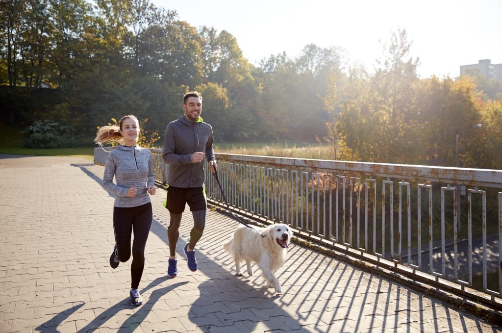 Man Running with Dog