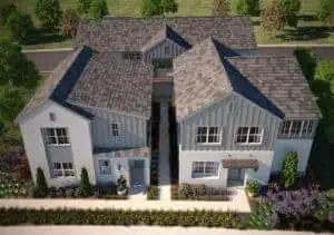 PlanABAERIALCAM030001 River Islands Aerial view of a modern two family house with gray shingled roofs white siding and manicured front yard landscaping