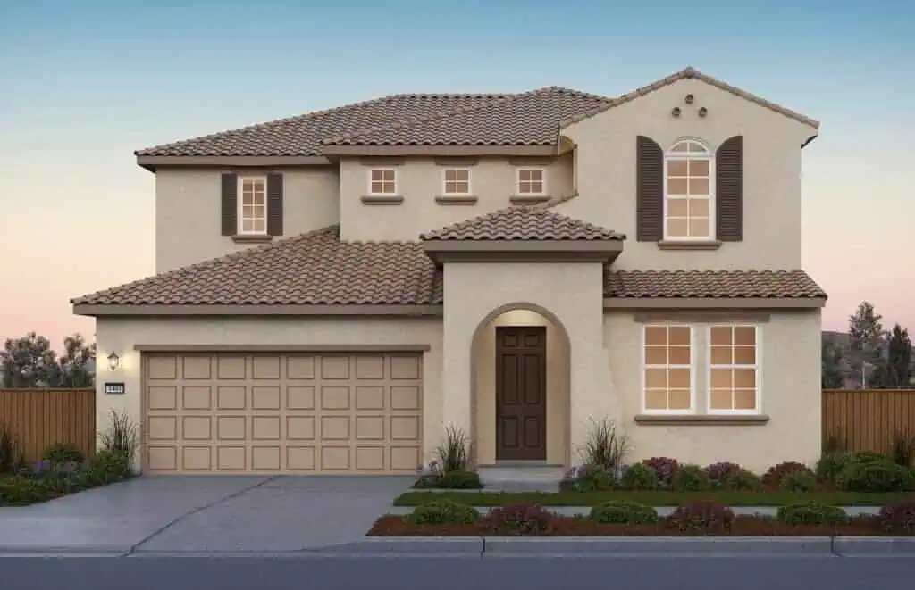 SunsetatRiverIslandsPlan1ElevationACS2webgeo River Islands Two story beige stucco house with brown tiled roof a prominent arched doorway and a three car style garage at the front