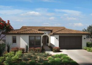 front of off white house with red roofing and brown garage
