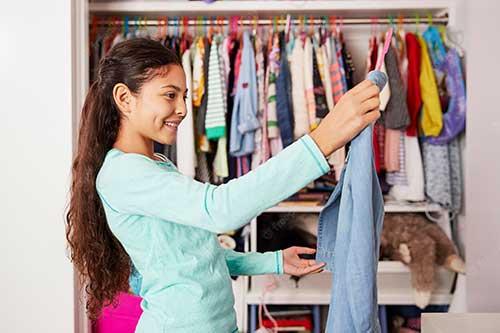 girl picks out clothes