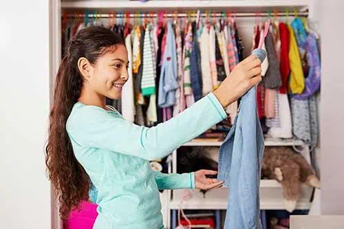girl picks out clothes