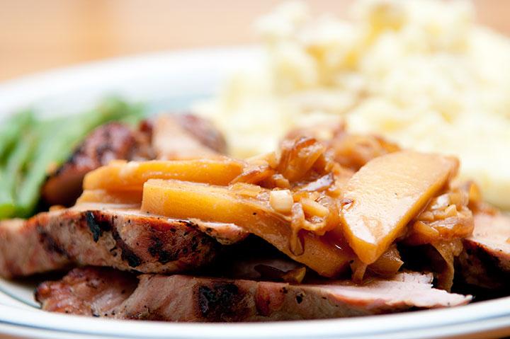 pork with apples on a plate