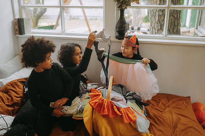 little girls making Halloween outfits