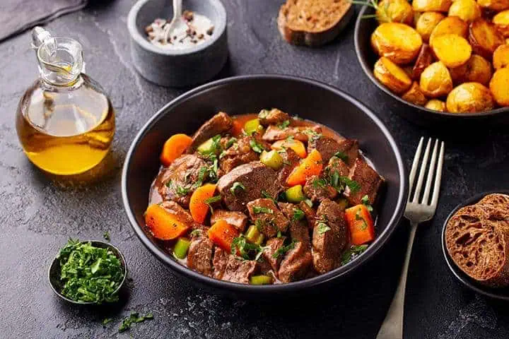 Image Text River Islands Irish stew in black bowl