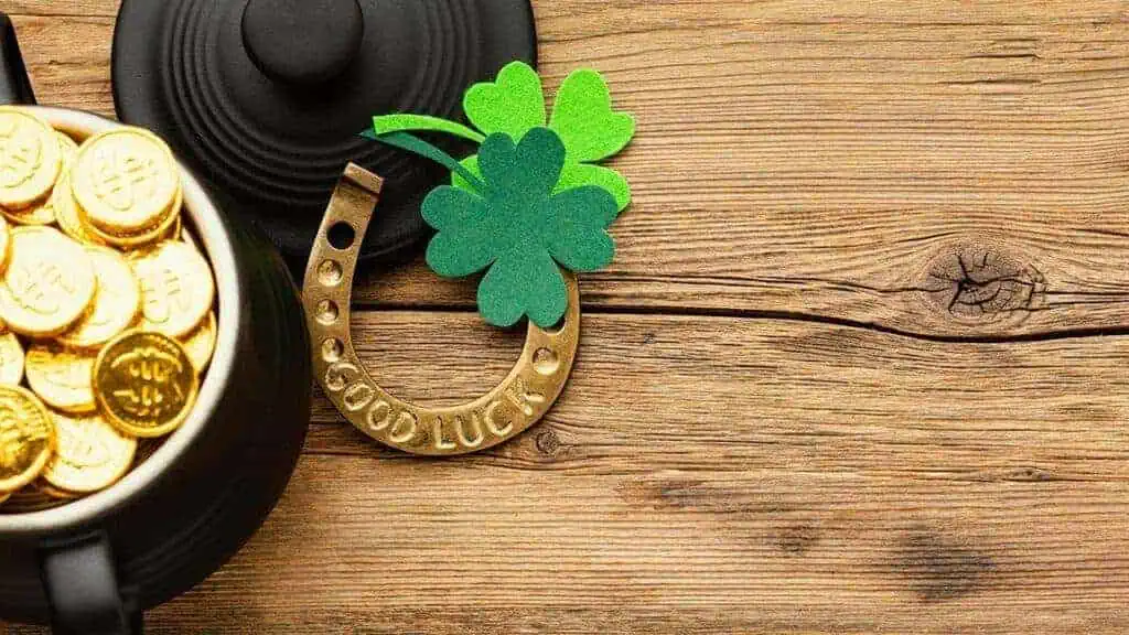 pot of gold shamrock and a gold horseshoe