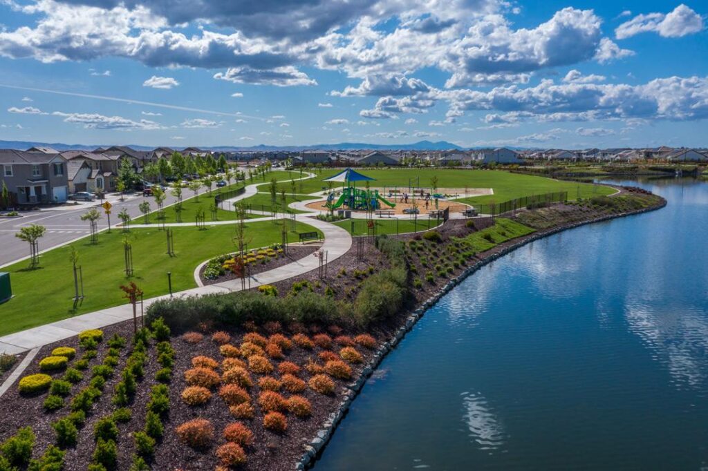 Subdivision School Districts River Islands an aerial view of Reflection Park with a beautiful blue sky on the horizon