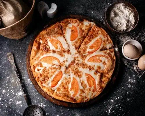4topviewpizzawithredtomatoescheesegreydesk500px River Islands pizza with peaches