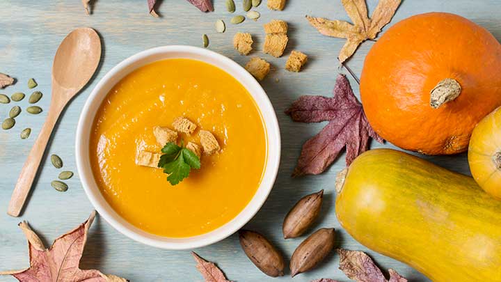 butternut squash soup with sqaush in bowl