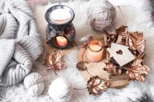 RIBlogFallDecor20230926Candles720 River Islands candles leaves and yarn on white fur 3780226789590045 12132193629810645