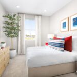 Secondary bedroom in Bridgeway Plan 3501 at River Islands, styled with bright natural light, modern décor, and a comfortable layout.