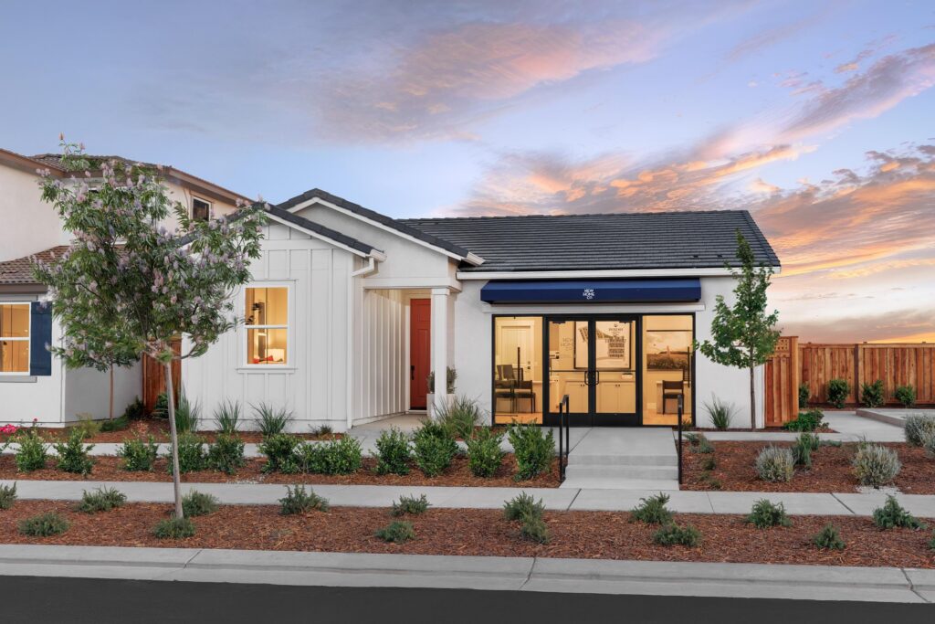 Exterior of Bridgeway Plan 3501 at River Islands by New Home Company showcasing modern two story home design with landscaped front yard