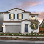 Two-story exterior of Bridgeway Plan 3502 at Bridgeway in River Islands with modern design, attached garage, and landscaped front yard.