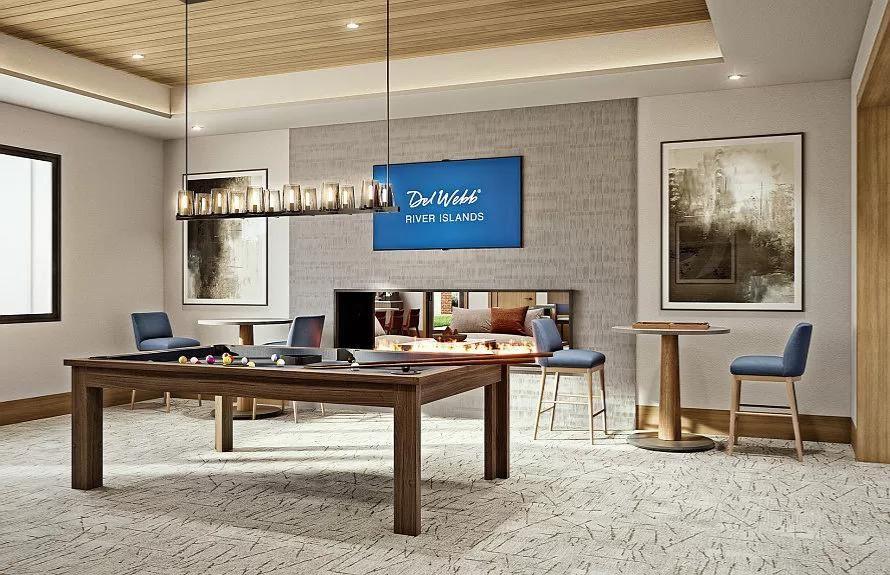 Billiards room inside the Lakeview Club at Del Webb River Islands, with a pool table, modern seating, and a welcoming lounge atmosphere.