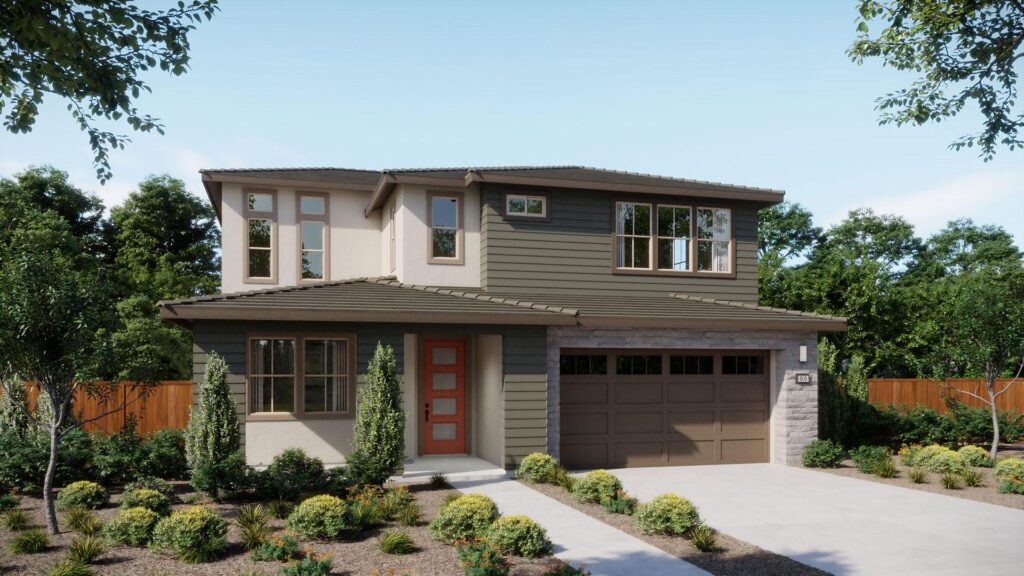Front view of a two-story modern house with a red entry door, grey-green siding, and a double garage, surrounded by landscaped desert garden.